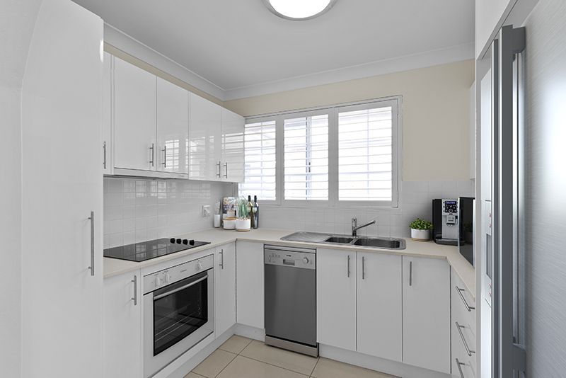 Exquisitely renovated light-filled unit overlooking croquet lawn.