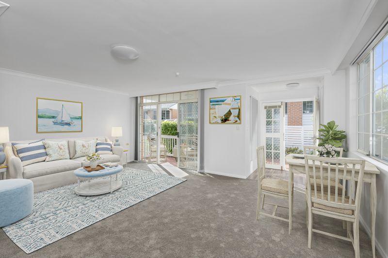 Centrally located, renovated ground floor unit surrounded by lush gardens with large courtyard.