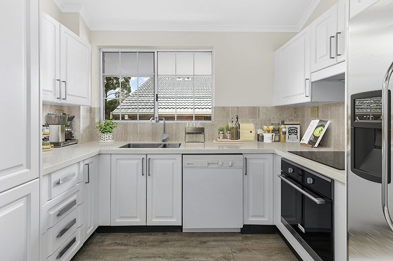 Immaculately presented upper level unit with leafy garden views