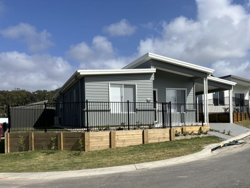 Opposite green space, on a corner lot