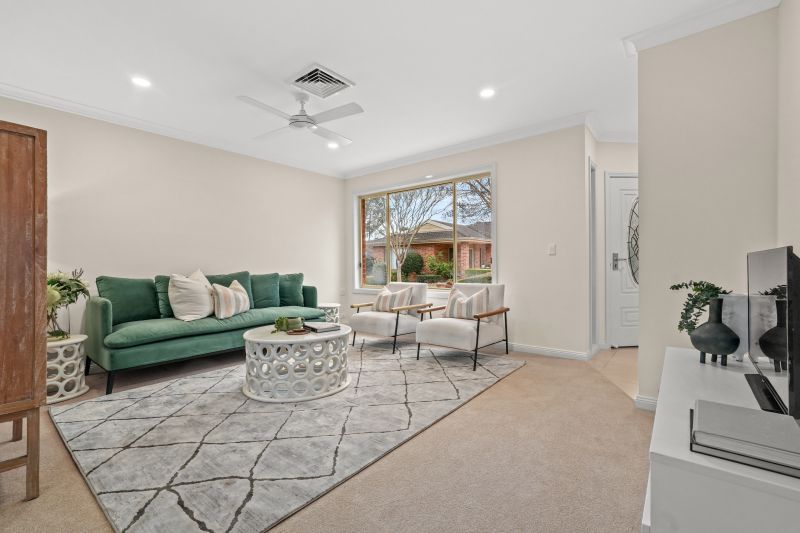 East facing rear aspect with enclosed sunroom & patio area for entertaining
