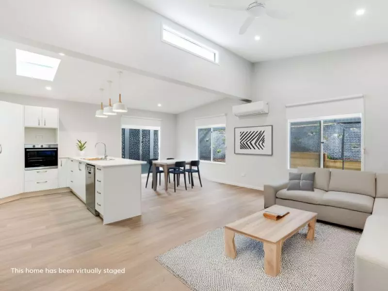 Opposite green space, on a corner lot