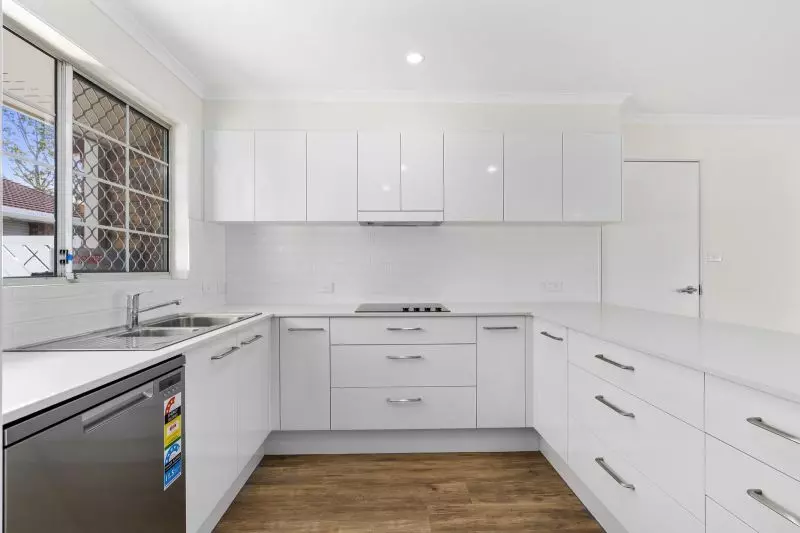 Beautiful two-bedroom, one bathroom villa with enclosed rear entertaining area.