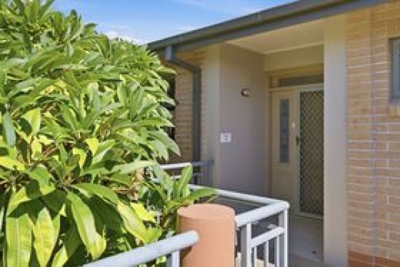 One of a kind corner unit with a wrap around balcony