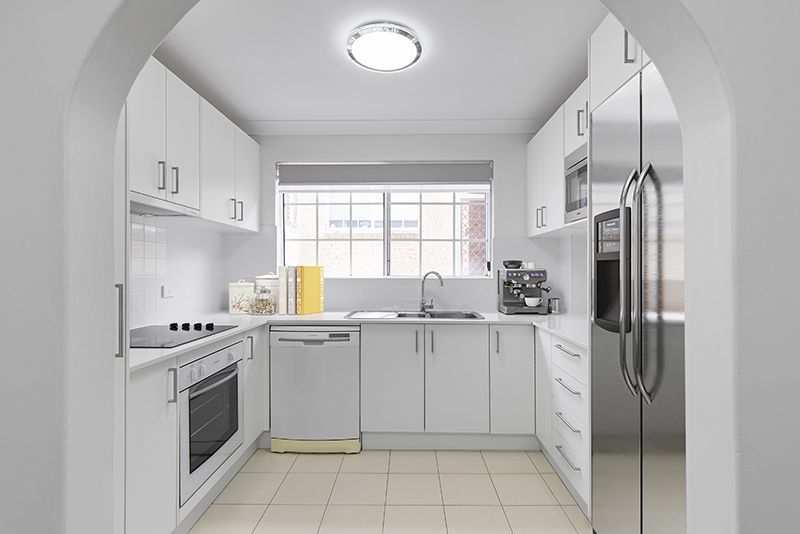 An elegant, fully renovated one-bedroom unit overlooking gardens.