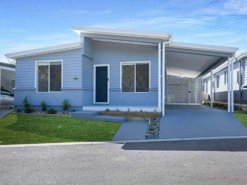 Opposite green space, on a corner lot