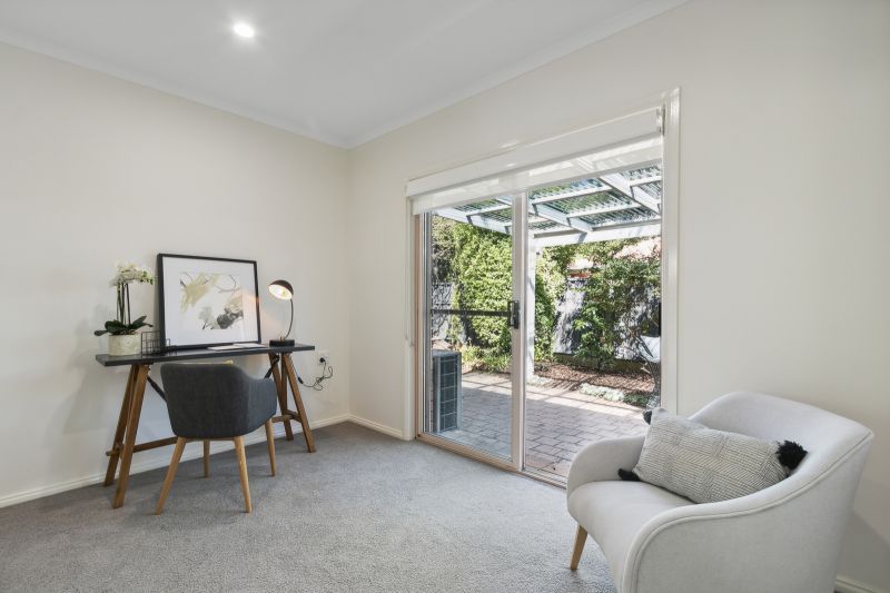 Exclusive three-bedroom villa featuring a pristine backyard