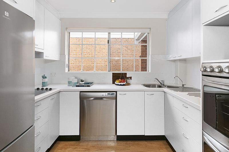 Perfectly located unit overlooking lush, green gardens.