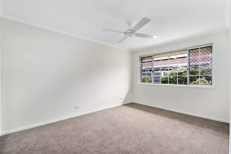 Beautiful two-bedroom, one bathroom villa with enclosed rear entertaining area.