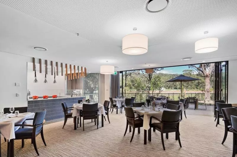 Rare upper level apartment with stunning Northern views over the bowling green.