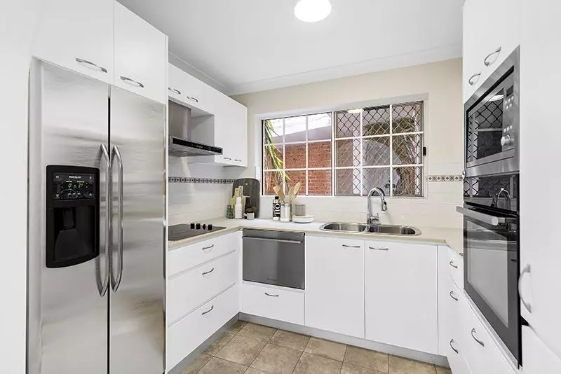 Elegantly renovated ground floor unit overlooking beautiful gardens close to clubhouse.