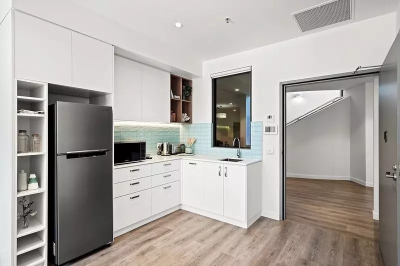 Rare upper level apartment with stunning Northern views over the bowling green.