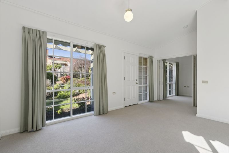 Village Heart Retreat with Vaulted Ceilings and Courtyard