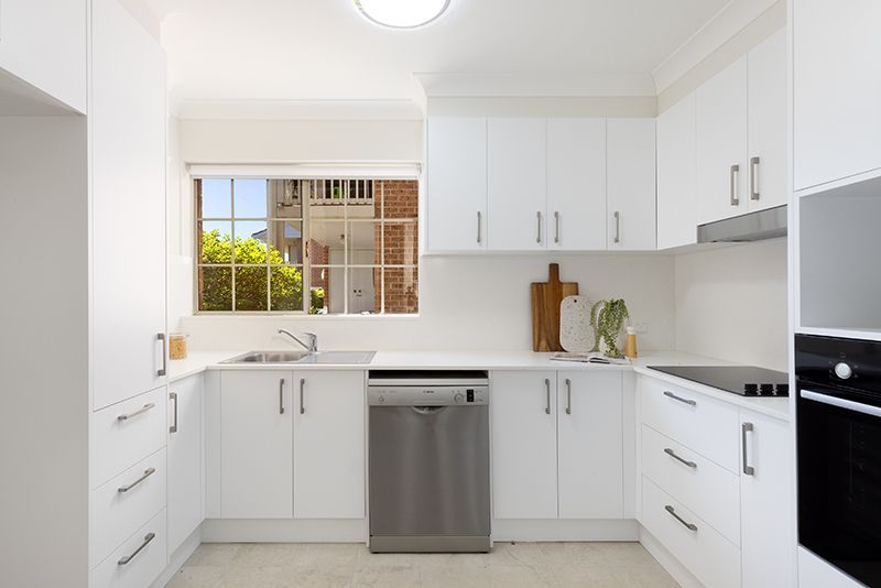 Surrounded by lovely gardens, beautifully renovated ground floor sun-filled unit, right opposite the croquet lawn.