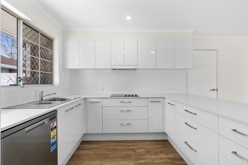 Beautiful two-bedroom, one bathroom villa with enclosed rear entertaining area.