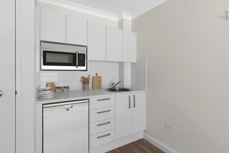 Beautifully renovated one bedroom serviced apartment with separate bedroom and ensuite plus kitchenette and terrace next to the pool area.