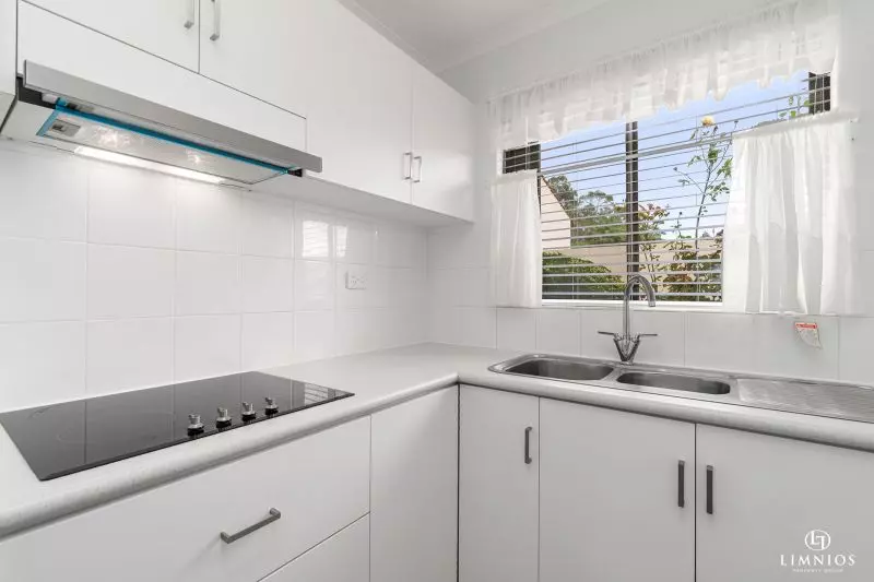 SOLD! A bright, light filled unit with a sunroom and leafy outlook