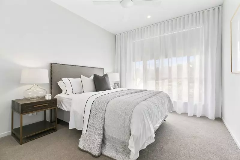 STUNNING DISPLAY HOME FACING TRANQUIL LAKE