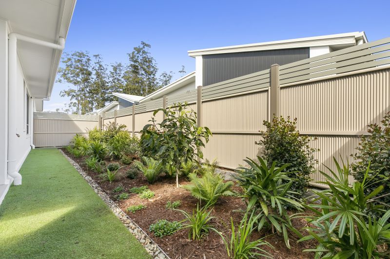 STUNNING DISPLAY HOME FACING TRANQUIL LAKE