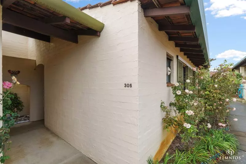 SOLD! A bright, light filled unit with a sunroom and leafy outlook