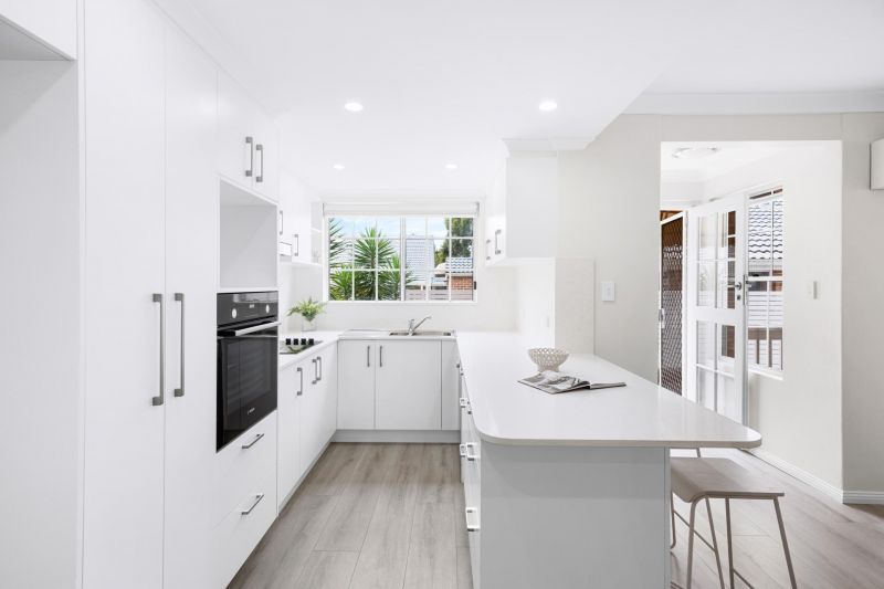 Fully renovated, contemporary style 3 bedroom unit with garden surrounds.