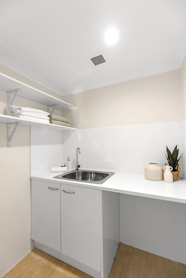 Ideally located, stylish ground floor unit near the Clubhouse with rear courtyard