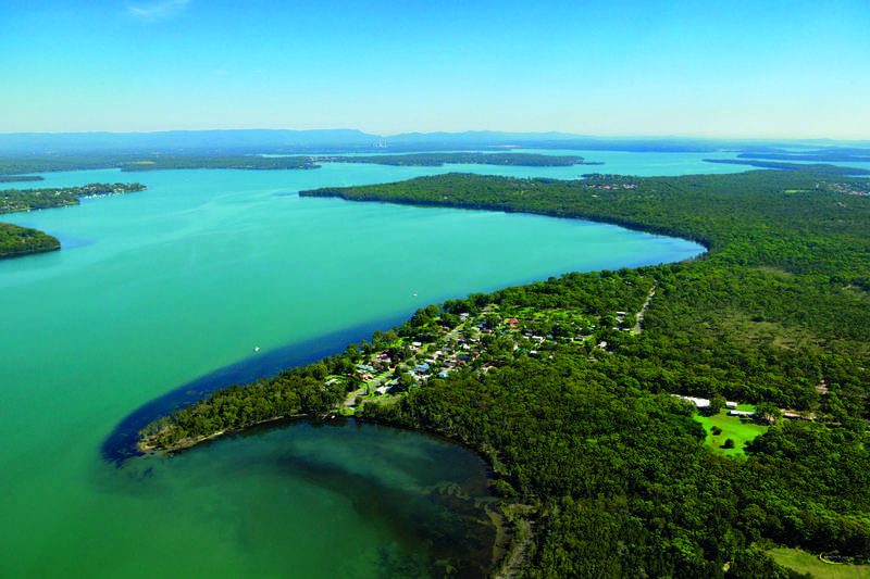 Brand new home nestled by the water’s edge
