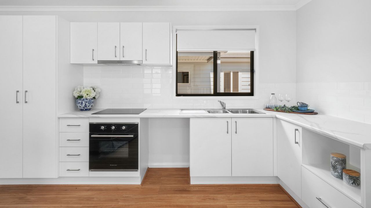 Step into the Pencott, where a charming wrap-around front patio greets you - Lot 176.