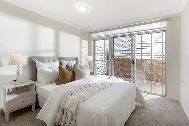 Surrounded by lovely gardens, beautifully renovated ground floor sun-filled unit, right opposite the croquet lawn.