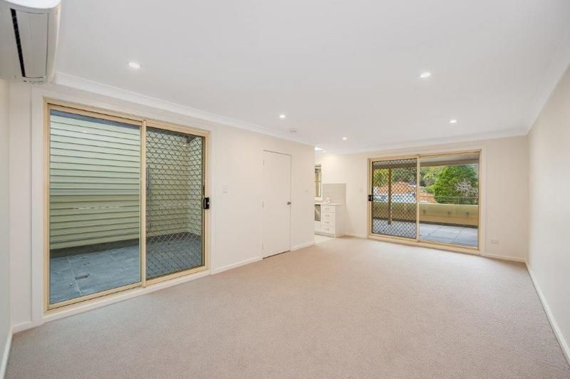 Modern Living with Sunroom and Entertainer’s Balcony