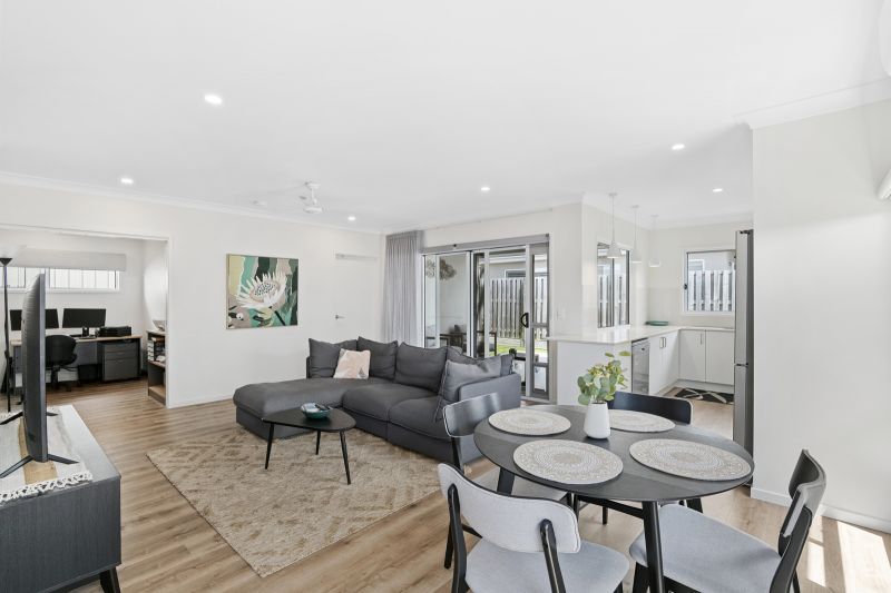 Elevated Home with Spacious Backyard and Modern Interior