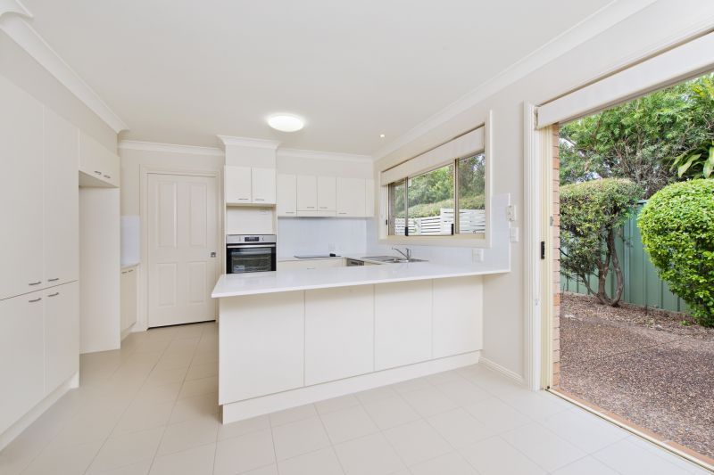 Level villa facing north to catch the winter sun with manicured grounds