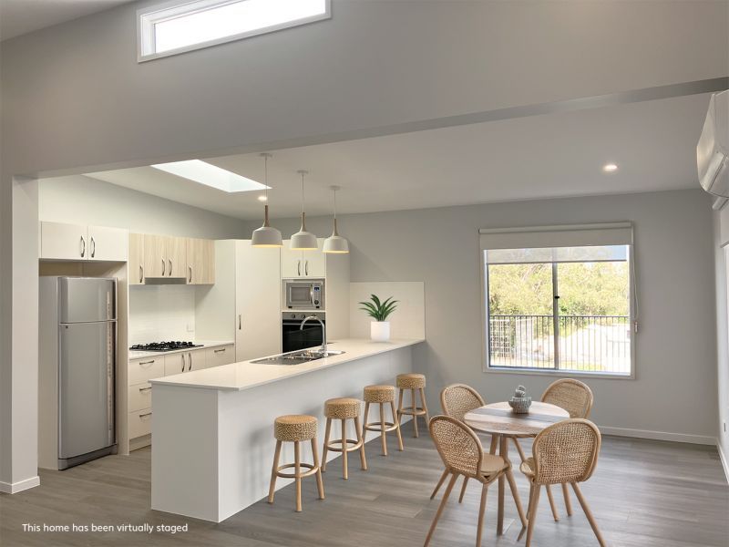 Opposite green space, on a corner lot