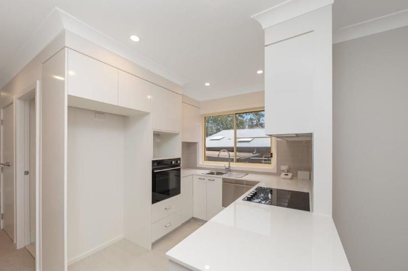 Modern, Spacious Living with Large Sunny Courtyard and Single Garage