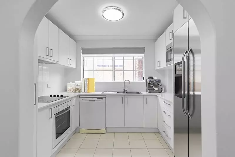 Immaculately maintained upper-level unit with district views and easy access ramp.