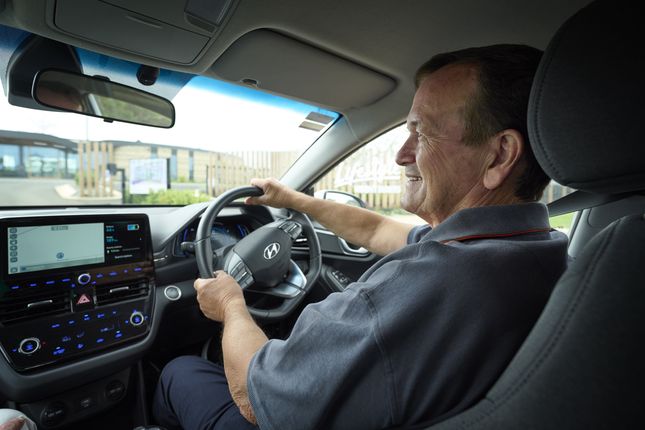 A Lifestyle community resident drives an electric car