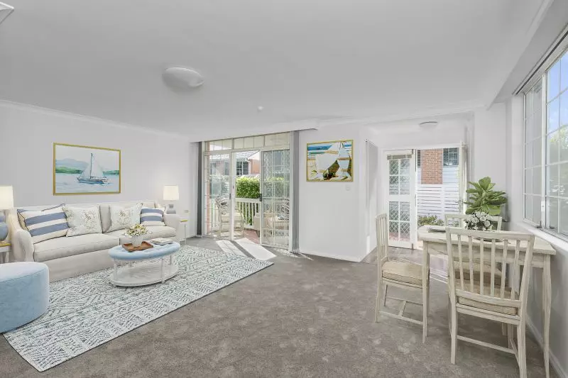 Centrally located, renovated ground floor unit surrounded by lush gardens with large courtyard.