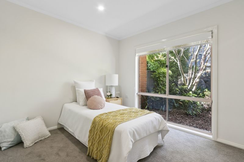 Exclusive three-bedroom villa featuring a pristine backyard