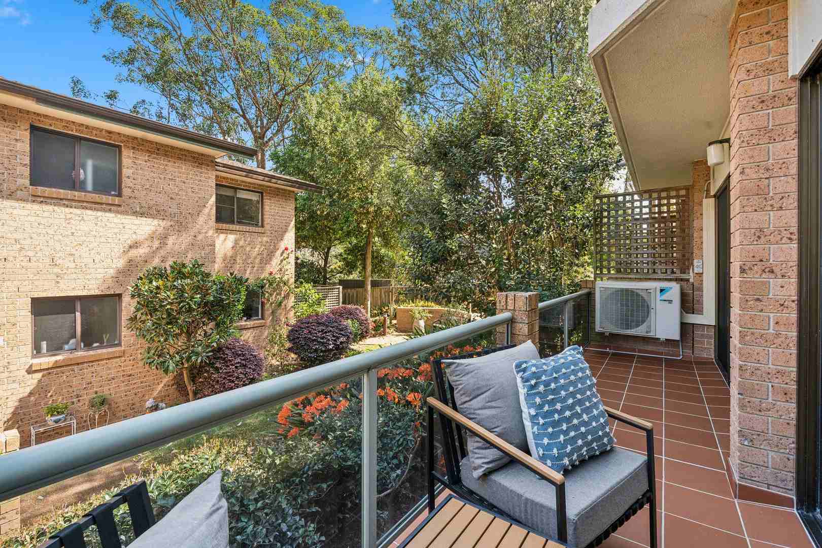 A serviced apartment surrounded by garden greenery