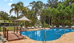 Downsize to this coastal hidden treasure surrounded by nature and just footsteps from a secluded beach