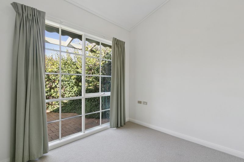 Village Heart Retreat with Vaulted Ceilings and Courtyard