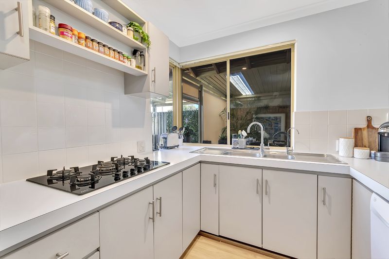 Sunny Yard and Vibrant Village Lifestyle