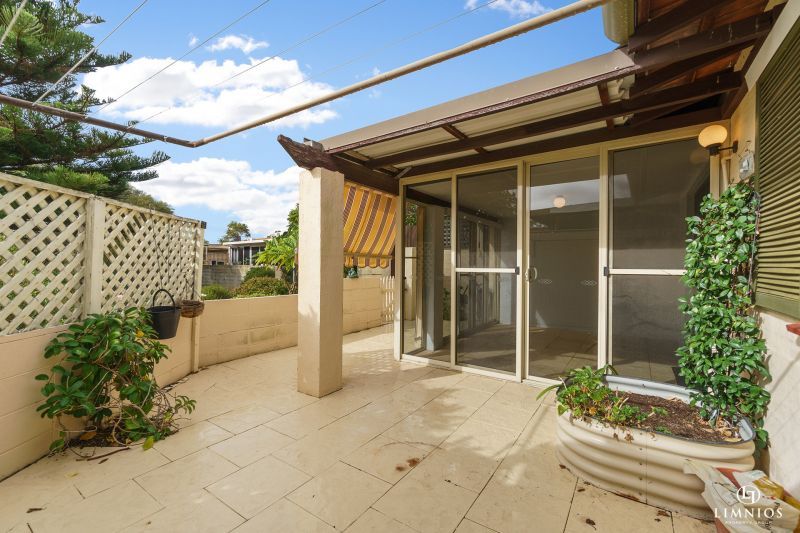 SOLD! A bright, light filled unit with a sunroom and leafy outlook