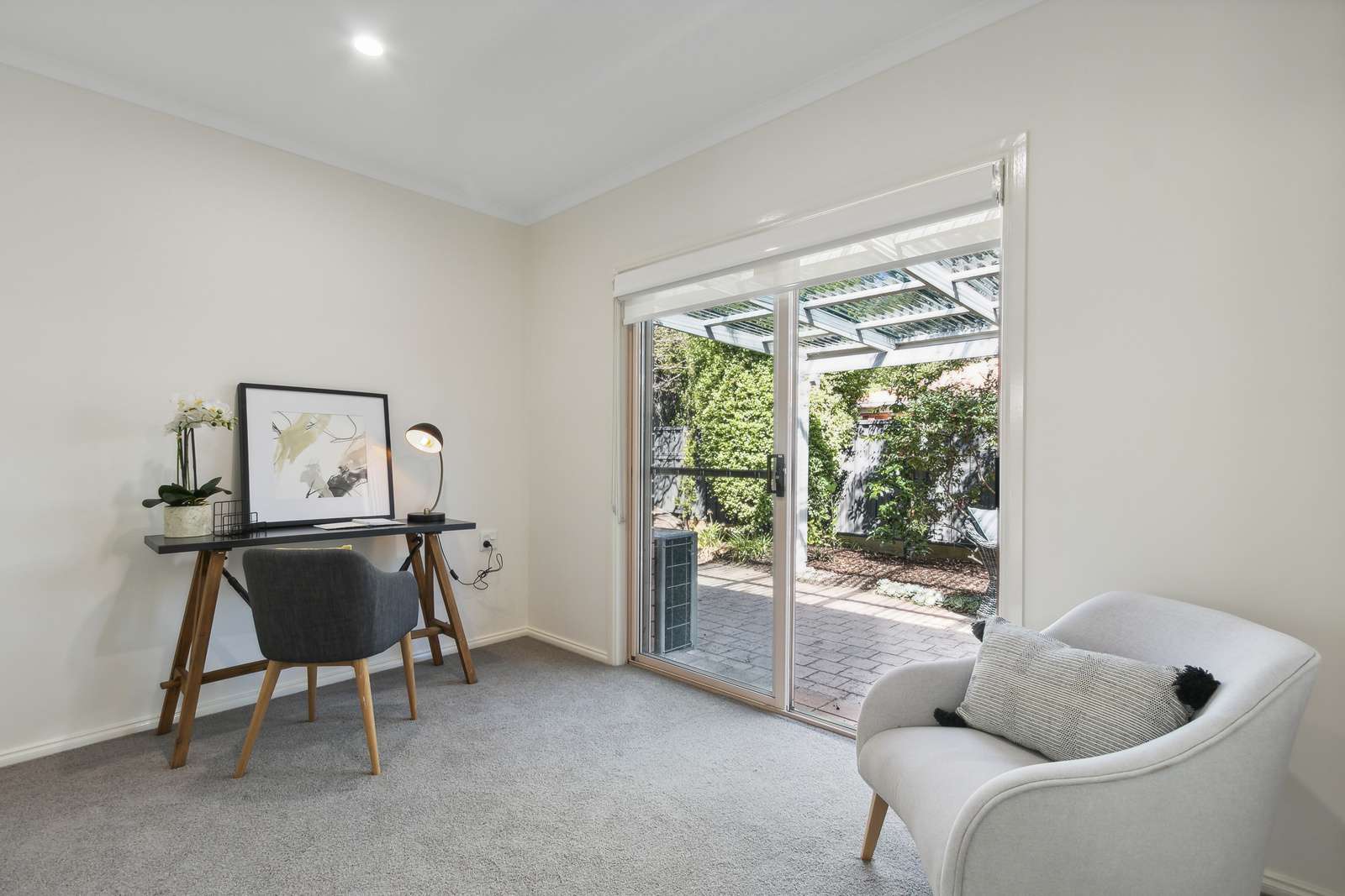 Exclusive three-bedroom villa featuring a pristine backyard