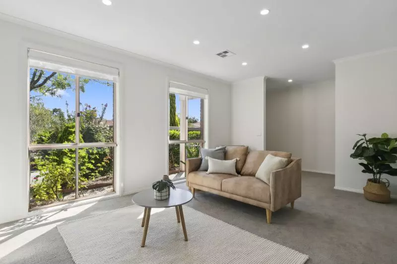 Exclusive three-bedroom villa featuring a pristine backyard