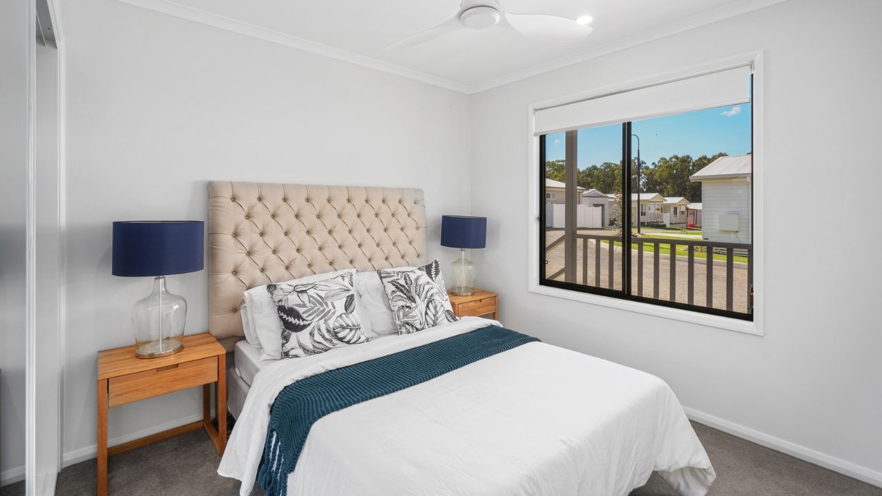 Step into the Pencott, where a charming wrap-around front patio greets you - Lot 176.