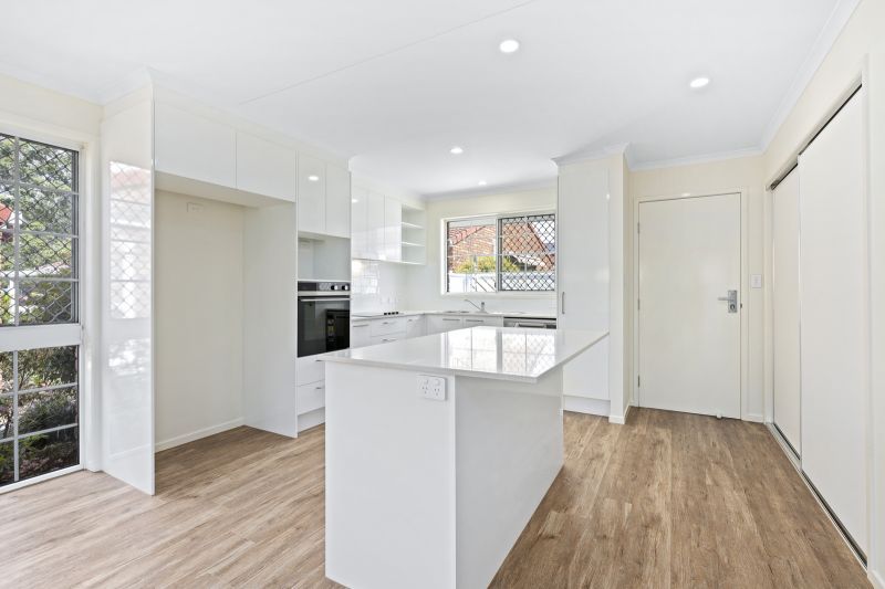 Beautiful two-bedroom, one bathroom villa with covered rear entertaining area.