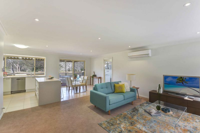 Sit back and relax on your patio! Looking onto the parkland enjoying the lifestyle here at Tarragal Glen!