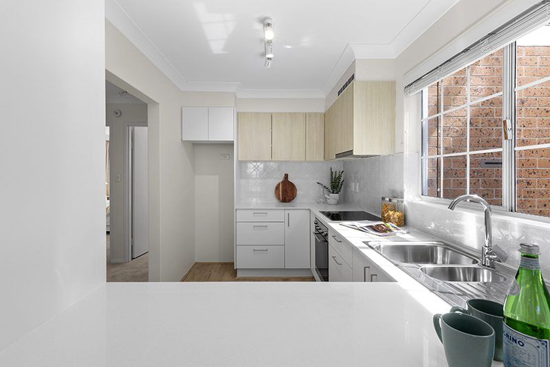 Ideally located, stylish ground floor unit near the Clubhouse with rear courtyard