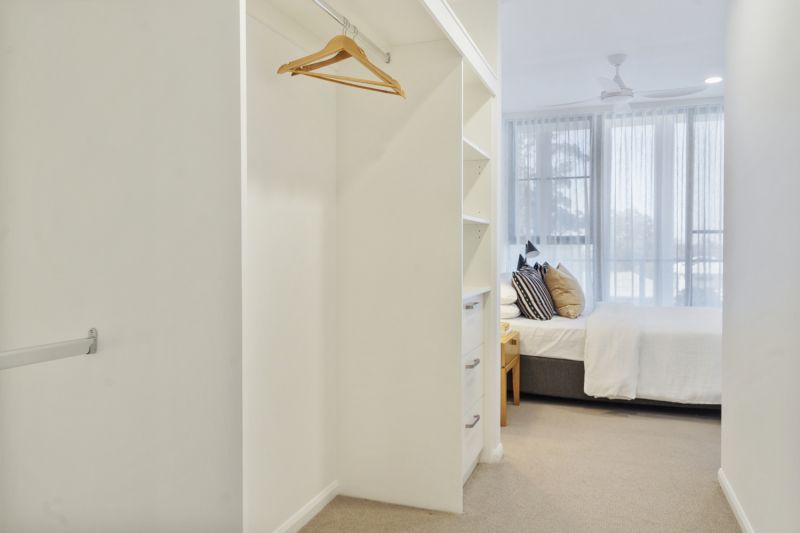 Elegant two-bedroom apartment with peaceful, tree-lined outlooks